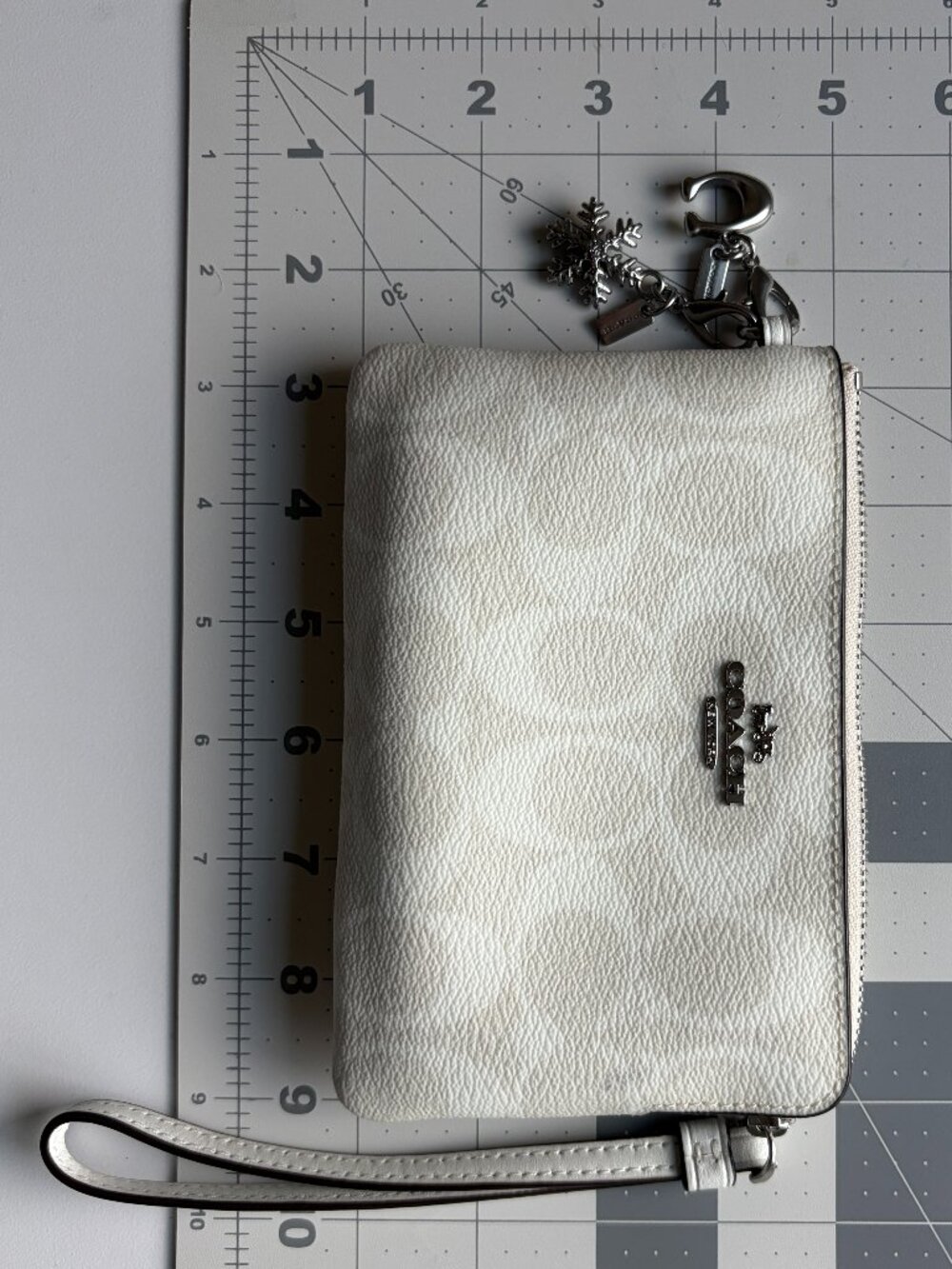 Coach Corner Zip Wristlet In Signature Canvas